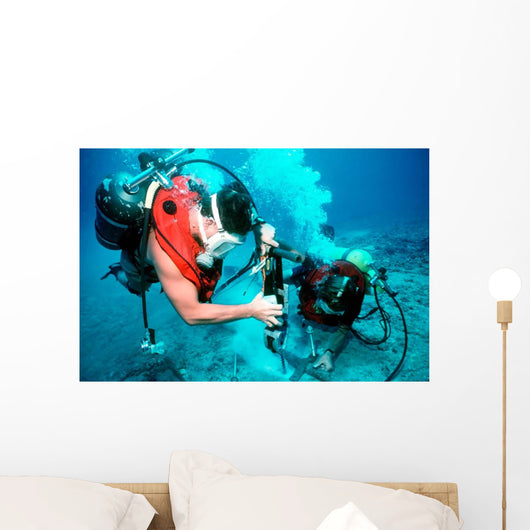 Divers Work to Repair Wall Decal