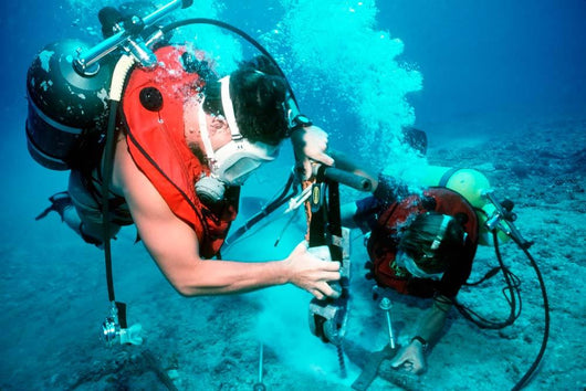 Divers Work to Repair Wall Decal