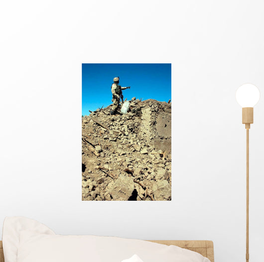 Us Army Soldier Examines Wall Decal