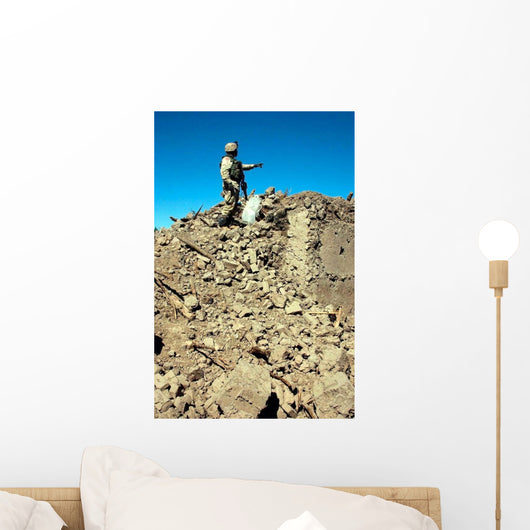 Us Army Soldier Examines Wall Decal