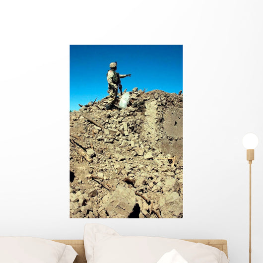 Us Army Soldier Examines Wall Decal
