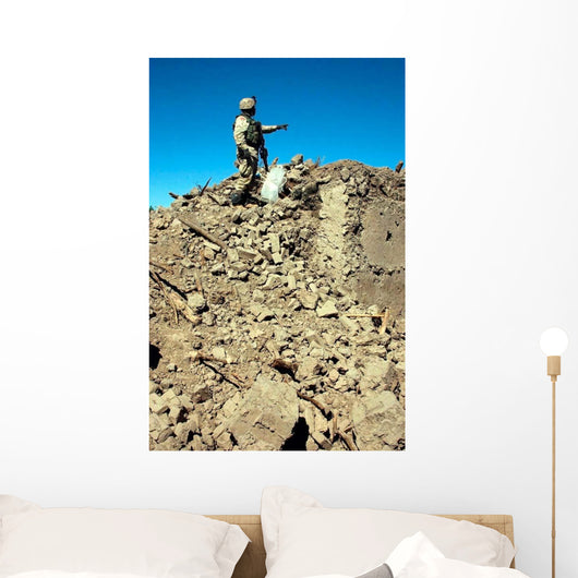Us Army Soldier Examines Wall Decal