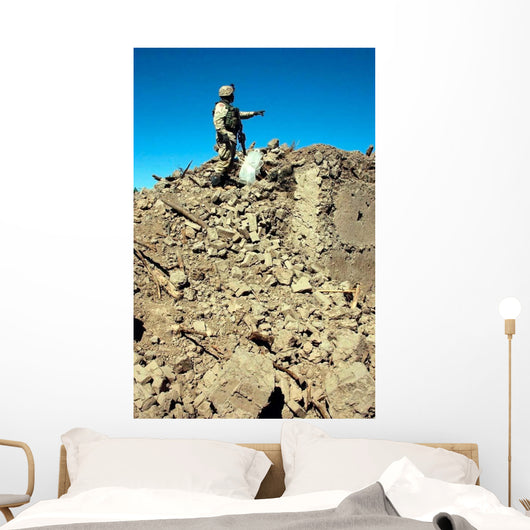 Us Army Soldier Examines Wall Decal