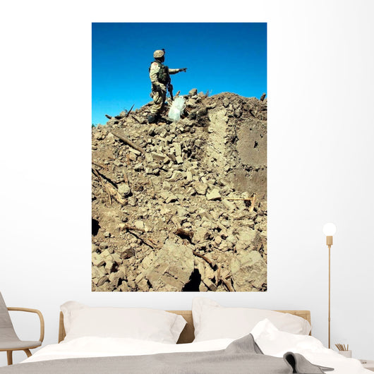 Us Army Soldier Examines Wall Decal
