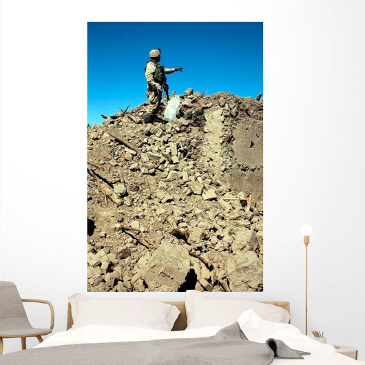Us Army Soldier Examines Wall Decal