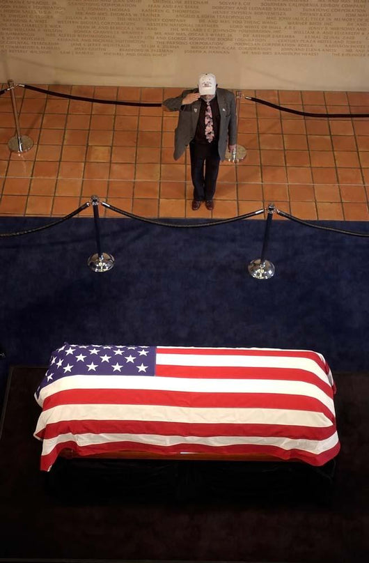 Mourner Pays His Respects Wall Decal