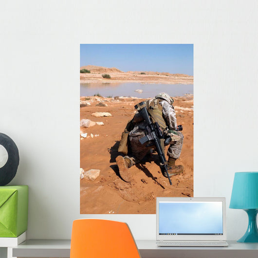Soldier Patrols along Riverbed Wall Decal