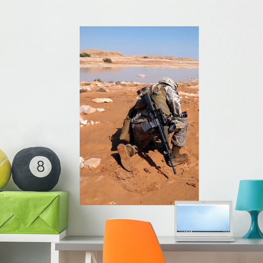 Soldier Patrols along Riverbed Wall Decal