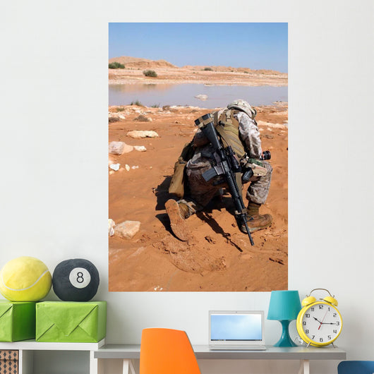 Soldier Patrols along Riverbed Wall Decal