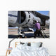 Aviation Fuel Technician Attaches Wall Decal