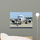 Aviation Electronics Technician Prepares Wall Decal