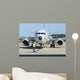 Aviation Electronics Technician Prepares Wall Decal