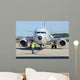 Aviation Electronics Technician Prepares Wall Decal