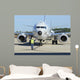 Aviation Electronics Technician Prepares Wall Decal