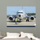 Aviation Electronics Technician Prepares Wall Decal