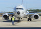 Aviation Electronics Technician Prepares Wall Decal